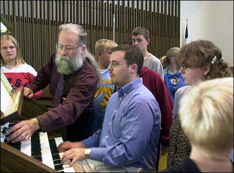 Michael Barone explains the organ stops with Minneapolis organist Daniel Schwandt at the console.