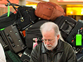 Prime Pipedreamer Barone checks the role, while the group's luggage prepares to roll. 