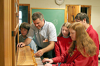 [Summer Arts Camp Organ Studio participants work with instructor Tom G. Bara]